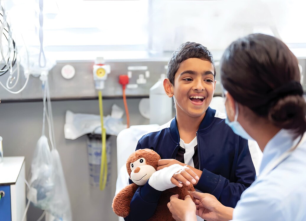child smiling at nurse