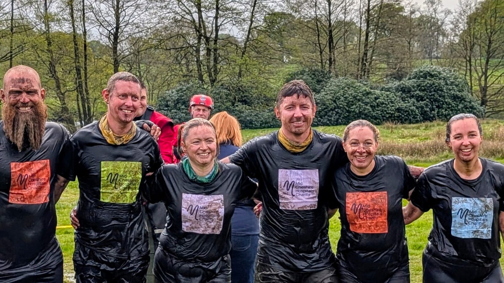 Group of muddy people who have just completed Born Survivor challenge