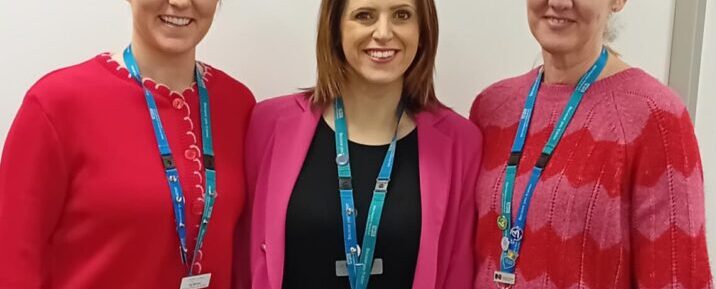 Women wearing red and pink for All Our Hearts Day