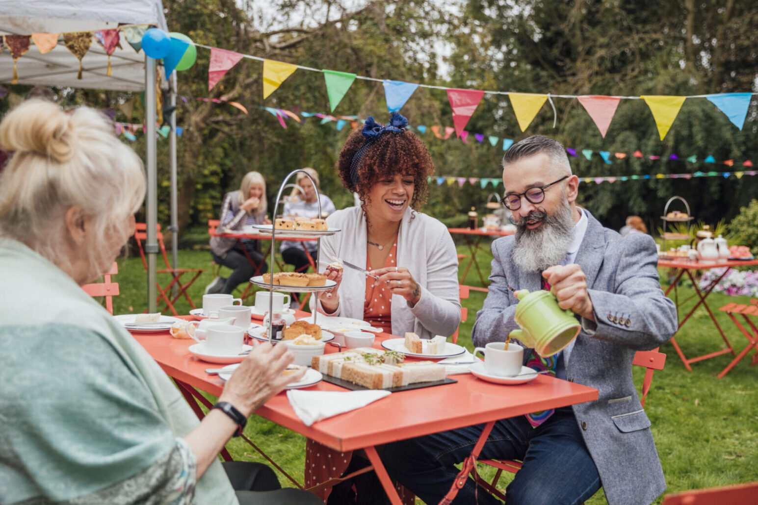 Group of friends enjoying an outside tea party