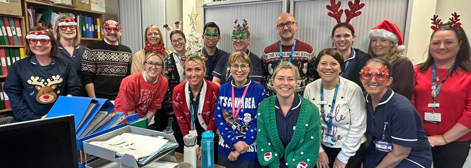 group of people wearing Christmas jumpers